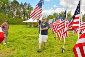 Don Rippetoe, of Southampton, carries a flag to its place while constructing the first annual Stars and Stripes Field of Honor, Monday, May 20, 2019 at Northampton Elks Lodge 997. Bruce Zeitler, left, of Florence, helped him. Both are veterans and members of the lodge.