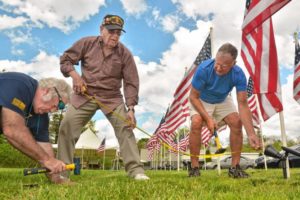 Don Rippetoe, of Southampton, from left, Bruce Zeitler, of Florence, and Ray Capers, of Northampton, take a measurement while constructing the first annual Stars and Stripes Field of Honor, Monday, May 20, 2019 at Northampton Elks Lodge 997. All are veterans and members of the lodge.