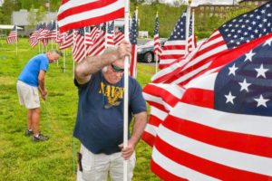 Don Rippetoe, front, of Southampton, places a flag as Ray Capers, of Northampton, readies a support for another, while constructing the first annual Stars and Stripes Field of Honor, Monday, May 20, 2019 at Northampton Elks Lodge 997. Both are veterans and members of the lodge.