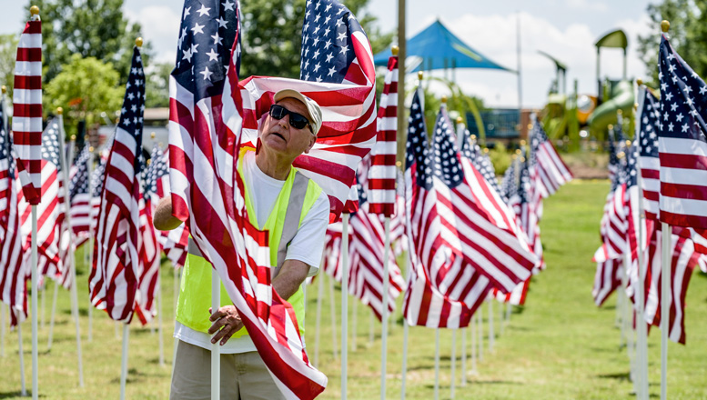 worker holding a flag