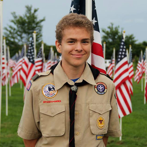 Boy Scout in front of Healing Field.