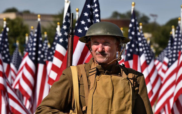 military man with flags