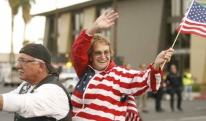 lady_on_bike_with_flag