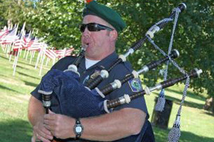 Serviceman playing bagpipes.