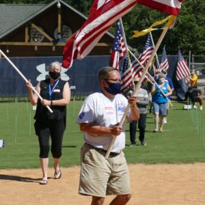 Jim Bowdish carrying flag