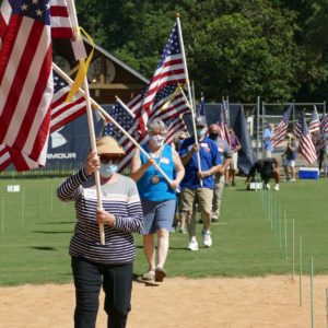 Mary Smith carrying flag on Friday