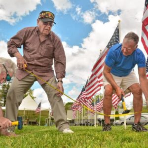 Don Rippetoe, of Southampton, from left, Bruce Zeitler, of Florence, and Ray Capers, of Northampton, take a measurement while constructing the first annual Stars and Stripes Field of Honor, Monday, May 20, 2019 at Northampton Elks Lodge 997. All are veterans and members of the lodge.