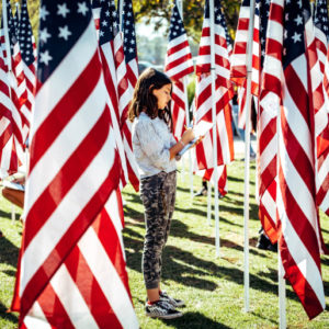 Berlyn Stackhouse, 10, a 5th grade student from Lisa J. Mails Elementary School, writes down information during a field trip to the Field of Honor at Town Square Park in Murrieta on Tuesday, Nov. 12, 2019. (Photo by Watchara Phomicinda, The Press-Enterprise/SCNG)
