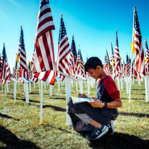 Kain Lopez, 10, a 5th grade student from Lisa J. Mails Elementary School, writes down information during a field trip to the Field of Honor at Town Square Park in Murrieta on Tuesday, Nov. 12, 2019. (Photo by Watchara Phomicinda, The Press-Enterprise/SCNG)