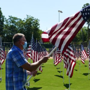 Dan Wakeley carries flag