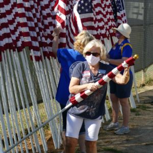 Debbie Pender preparing flag