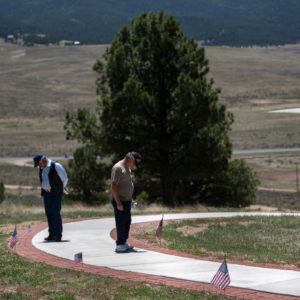 Mourners pay their respects Monday (May 28) after the 2018 Memorial Day Ceremony at the Vietnam Veterans Memorial in Angel Fire.