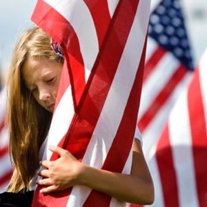 GIRL HUGGING FLAG