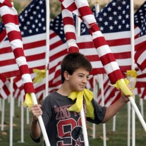 Boy holding flags