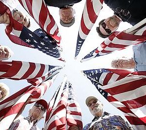 SVETERANS06Asf
(Metro, Murrieta, 9-03-09)
Clockwise from top, Bob Kast, Bob Bryant, Frank Donahoe, Dennis McCarbery, Bob Corsiglia, Patsy Orr, Dick Lawe, and Pete Palmer hold a few of the 2,000 flags that will be flown at Murrieta Town Square Park from November 8th through the 14th in honor of Veterans Day.  (The Press-Enterprise/Silvia Flores)